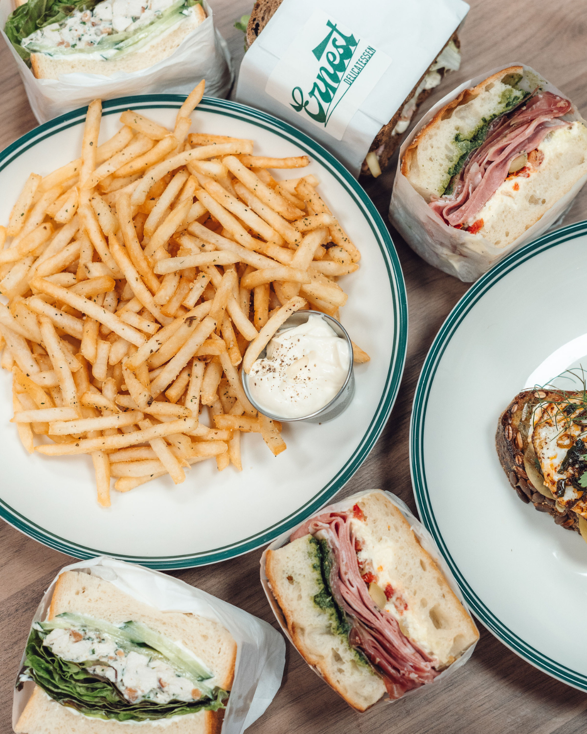Fries, deli meats sandwich and chicken salad sandwich at Ernest Deli