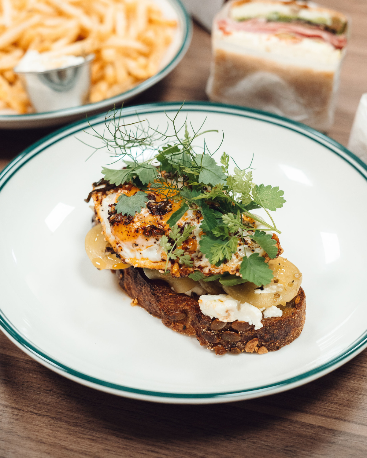 Crispy egg and herb-topped toast at Ernest Deli